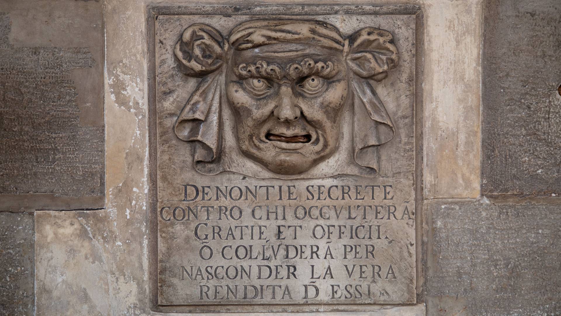 Detail of face on wall of Doge's Palace in Venice