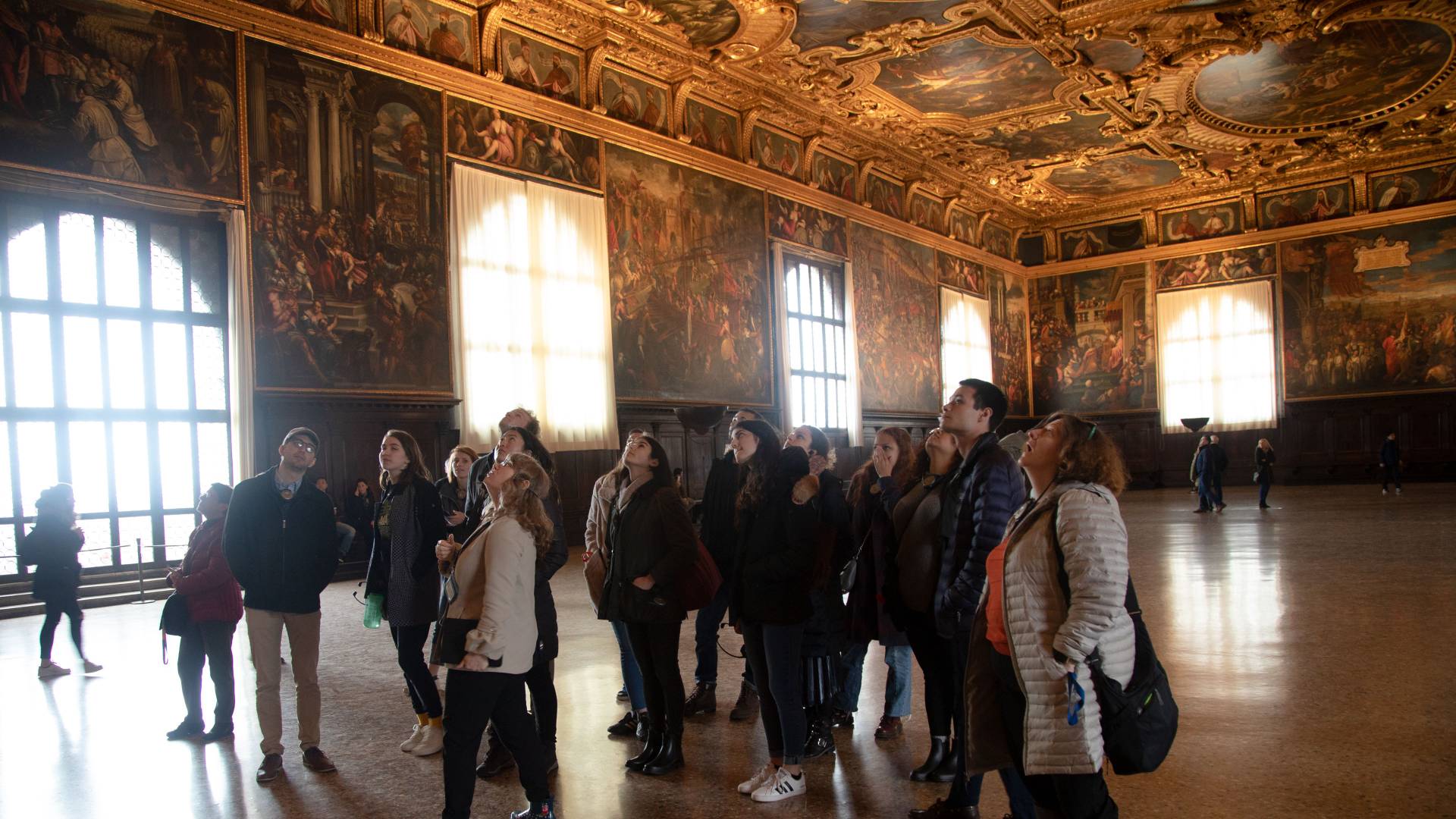 Students looking up at ceiling in Doge's Palace in Venice