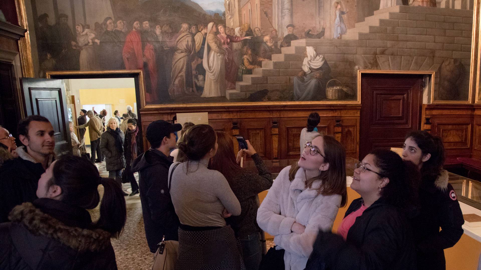 Students looking up at artwork in Gallerie dell'Accademia in Venice