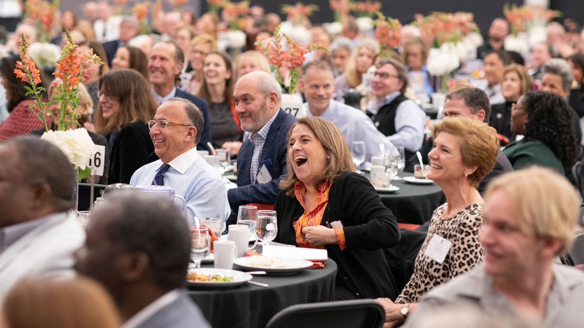 Audience laughs while at Service Recognition luncheon