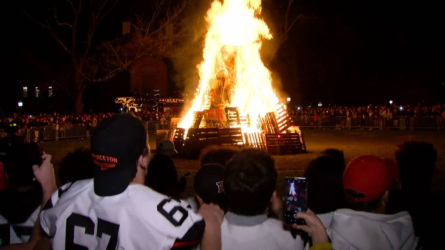 Students look on at the bonfire