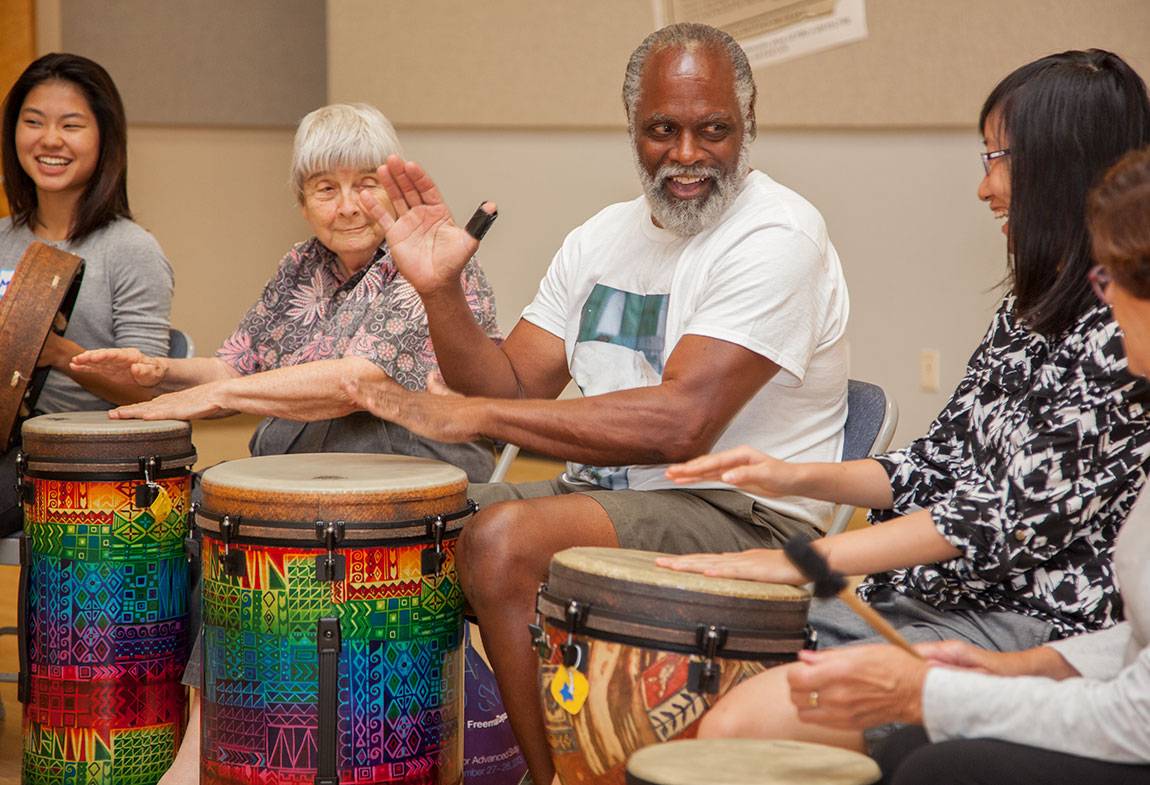 Princeton students with Seniors in drum circle