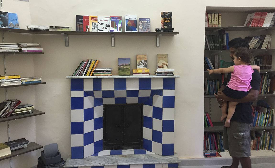 A Tale of Two Countries: Greece - a babysitter in library Mosaik Support Center for refugees