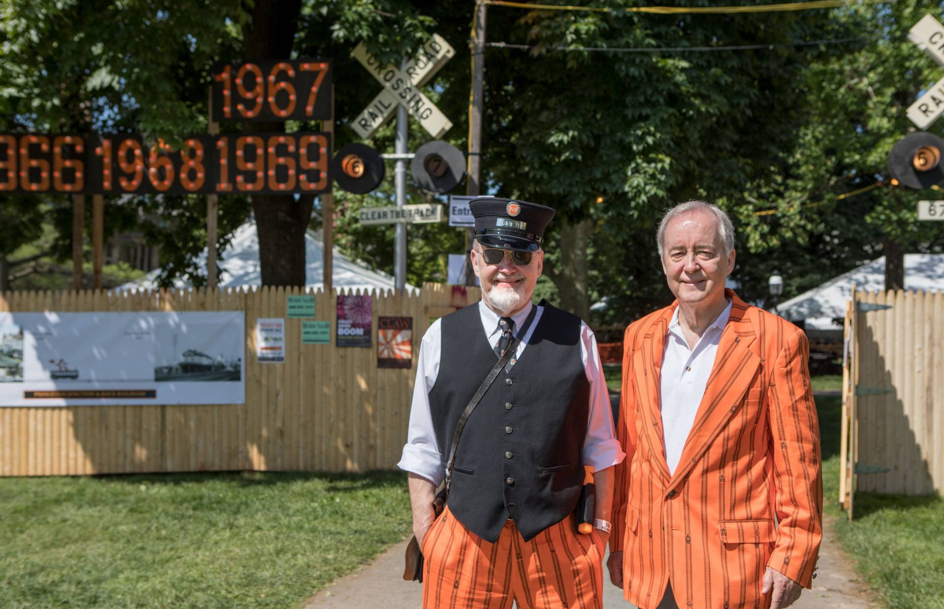 Tom and Tim Tulanko from class of 1967 in front of Reunions fence