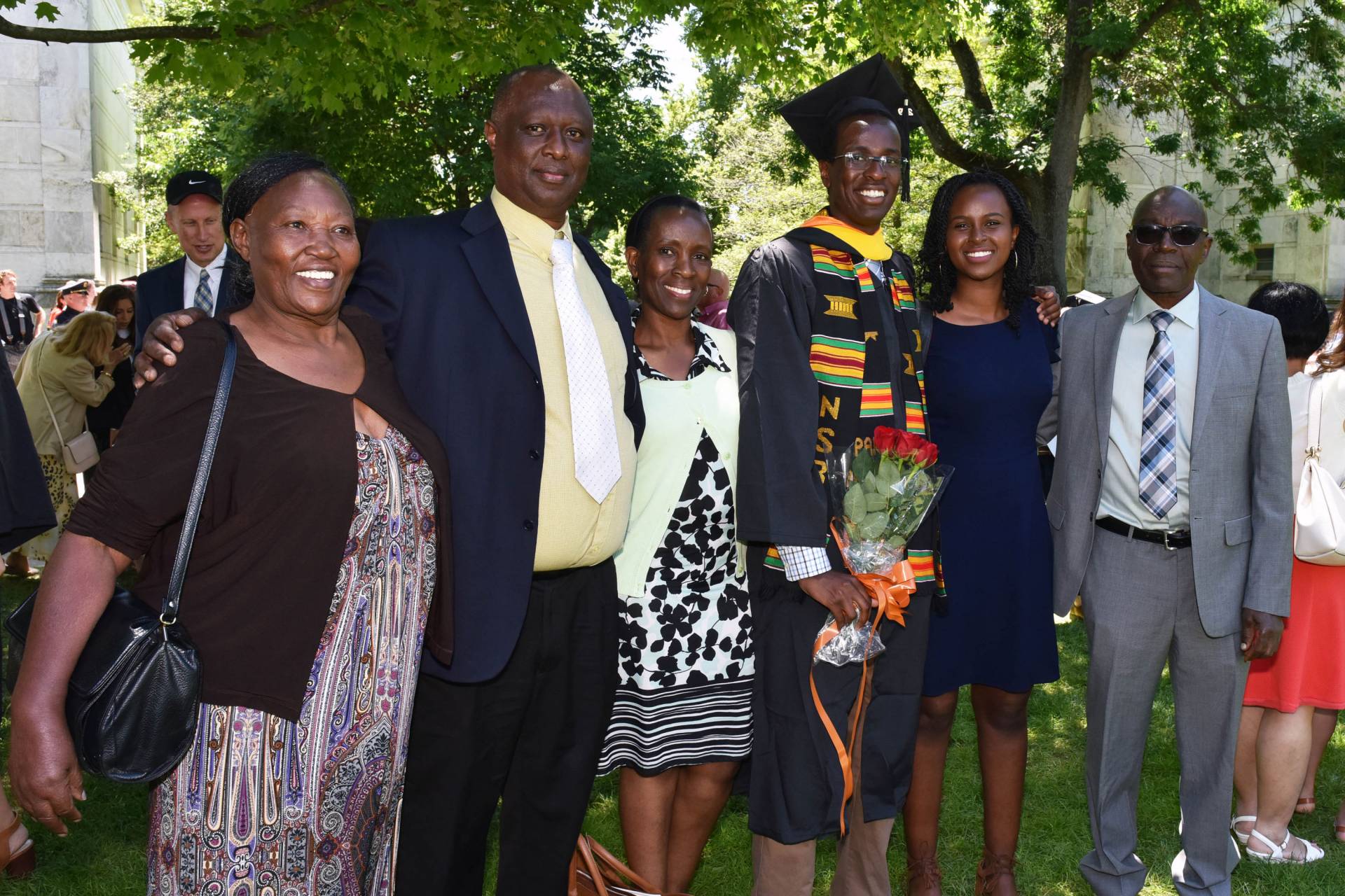 Njuguna Thande standing with family