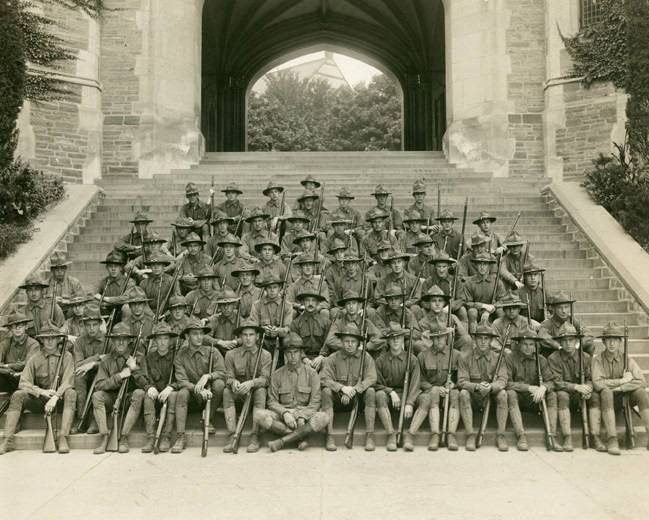 Students in military uniform pose under Blair Arch circa 1915