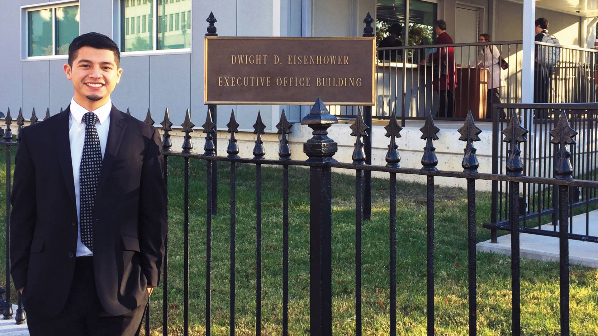 Luis Carchi standing outside Dwight D. Eisenhower building