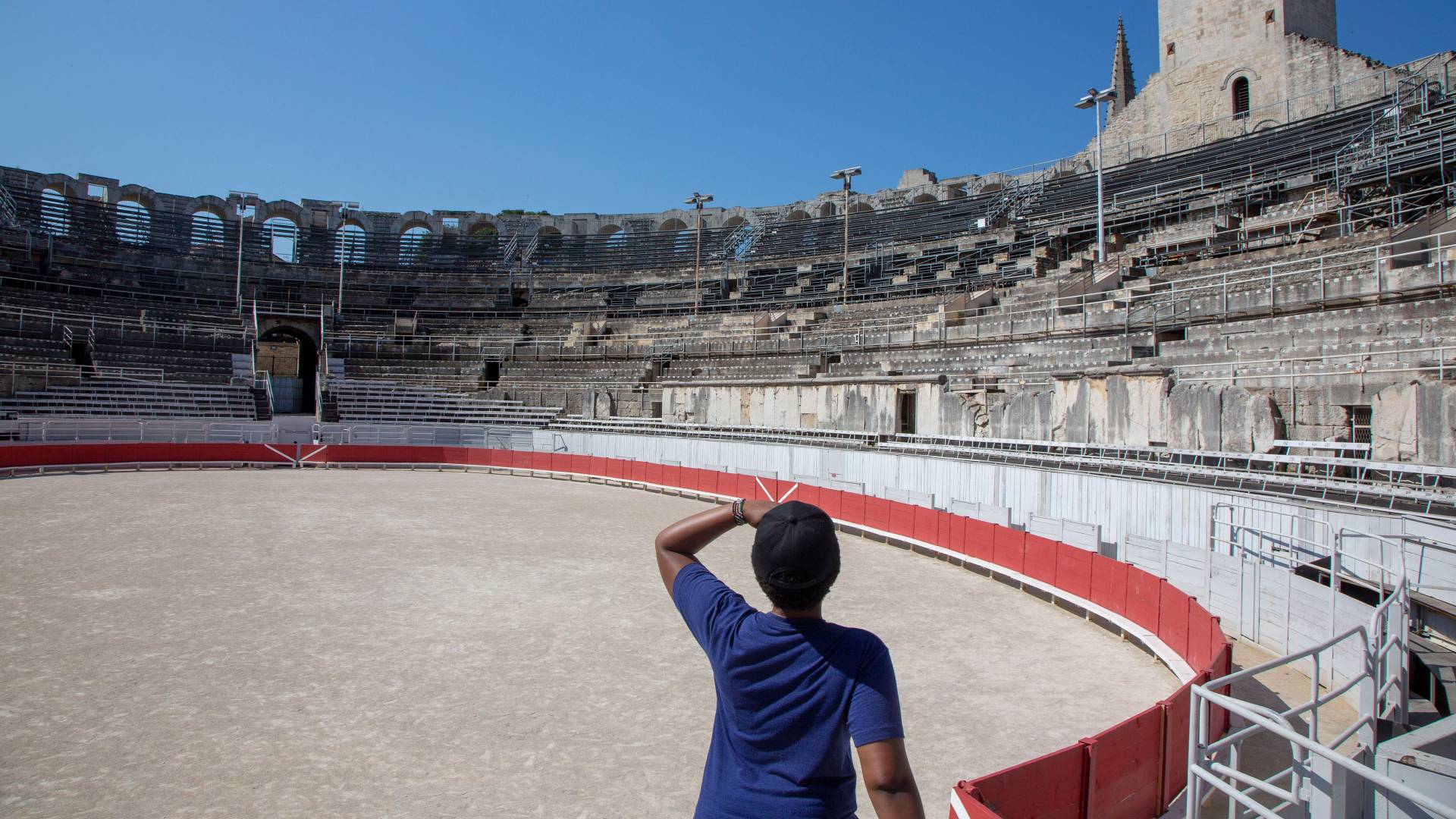 Student looking at amphitheater in Arles, France