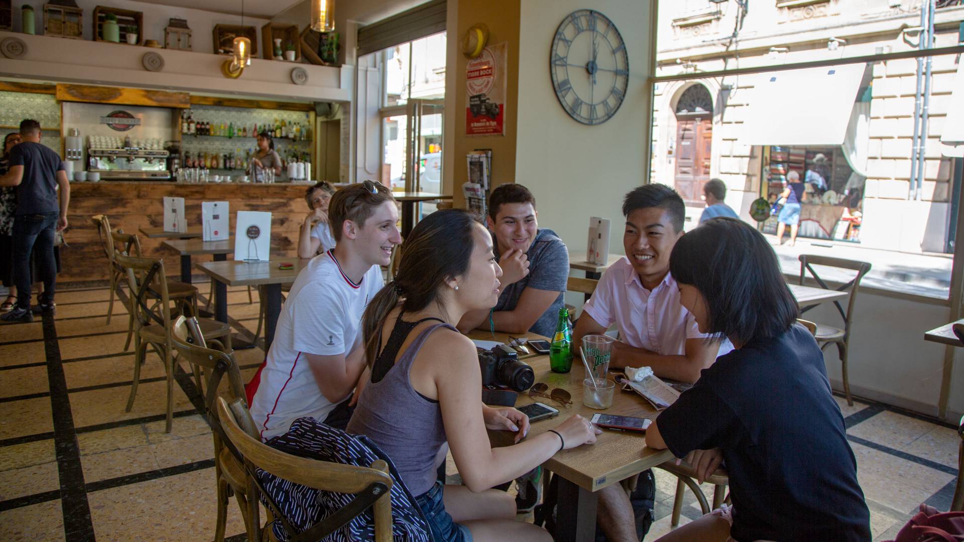 Students eating at a cafe in Arles, France