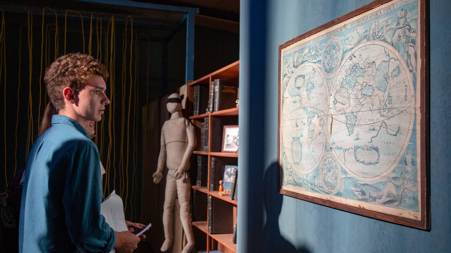 Students looking at ancient map in art installation in Athens, Greece