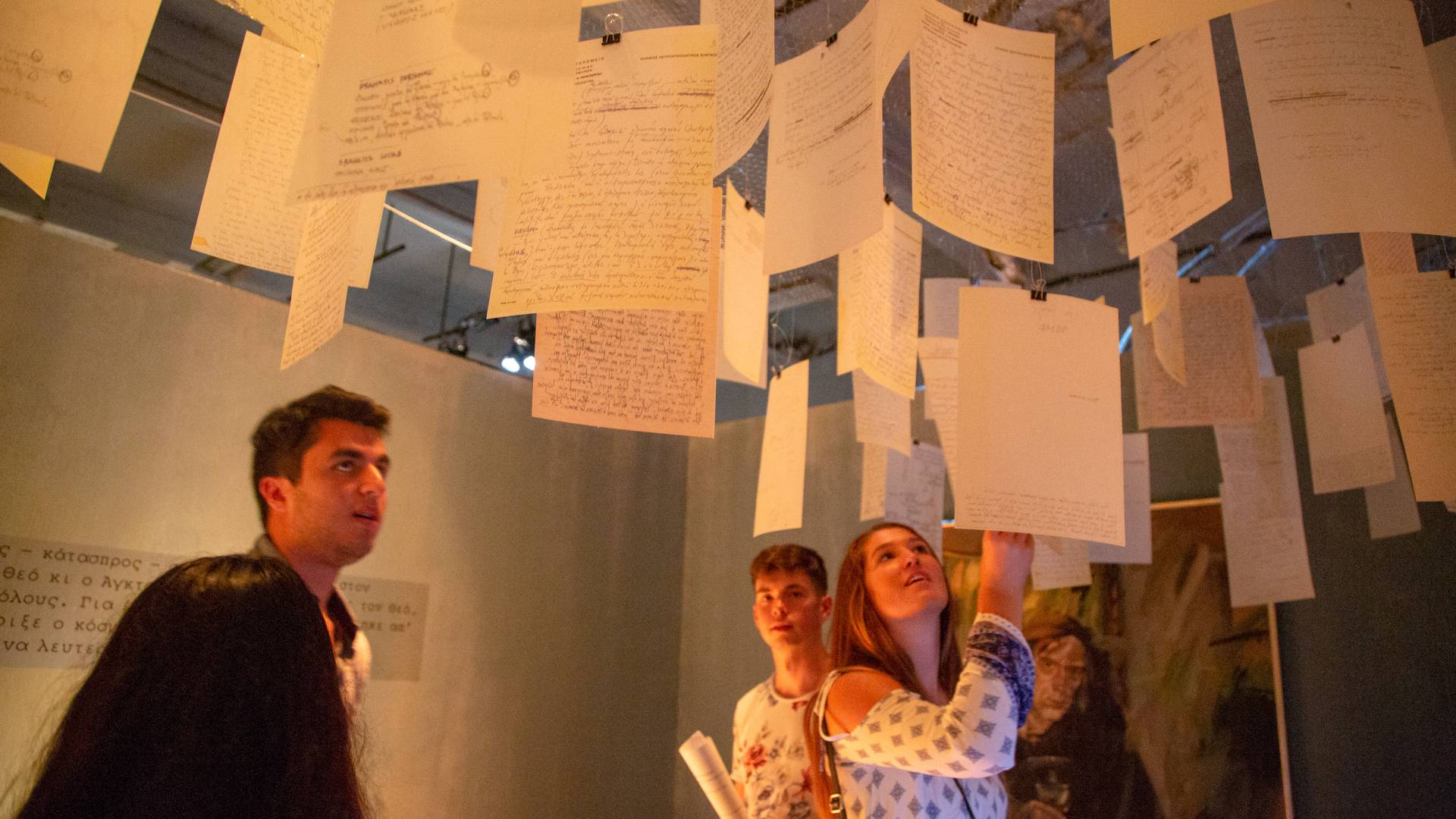 Students looking at art installation in Athens, Greece