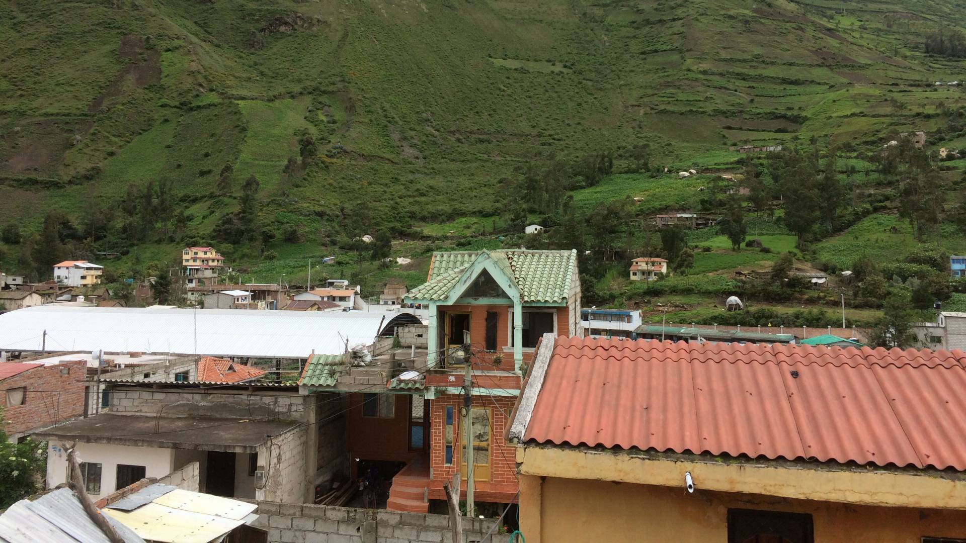 Rooftops and mountain in background in Ecuador