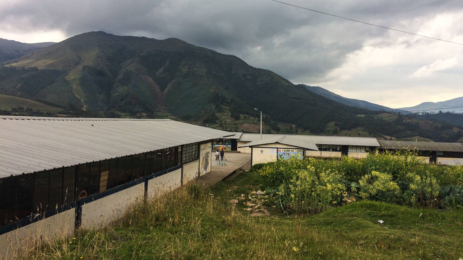 School building with mountains in background in Ecuador