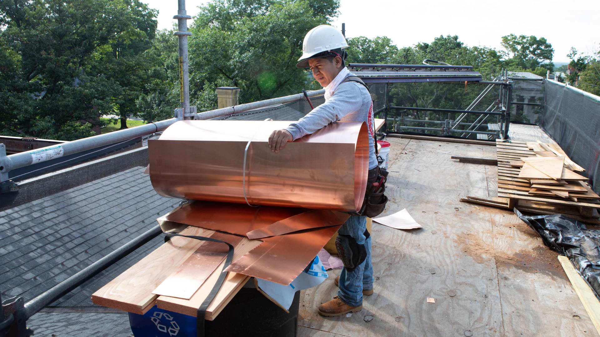 Working handling copper sheets on Nassau Hall cupola