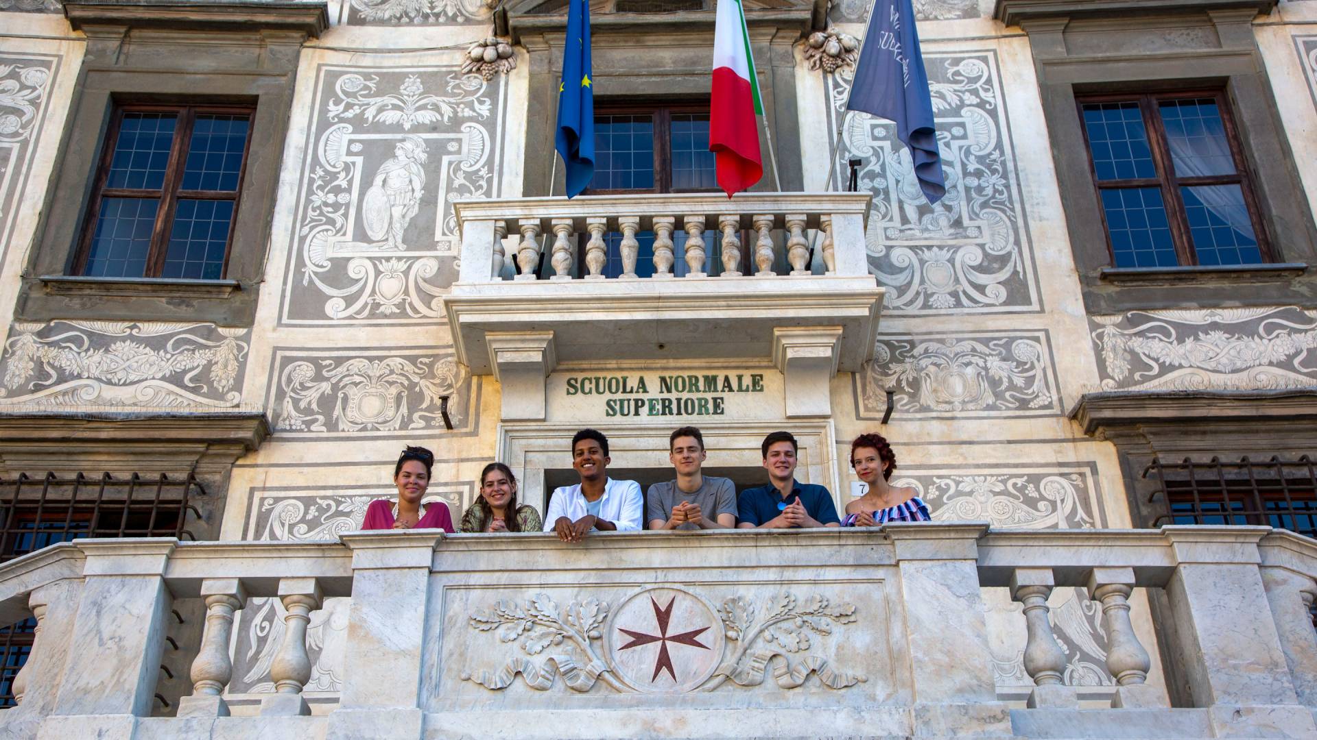 Students standing atop the steps of the Scuola Normale
