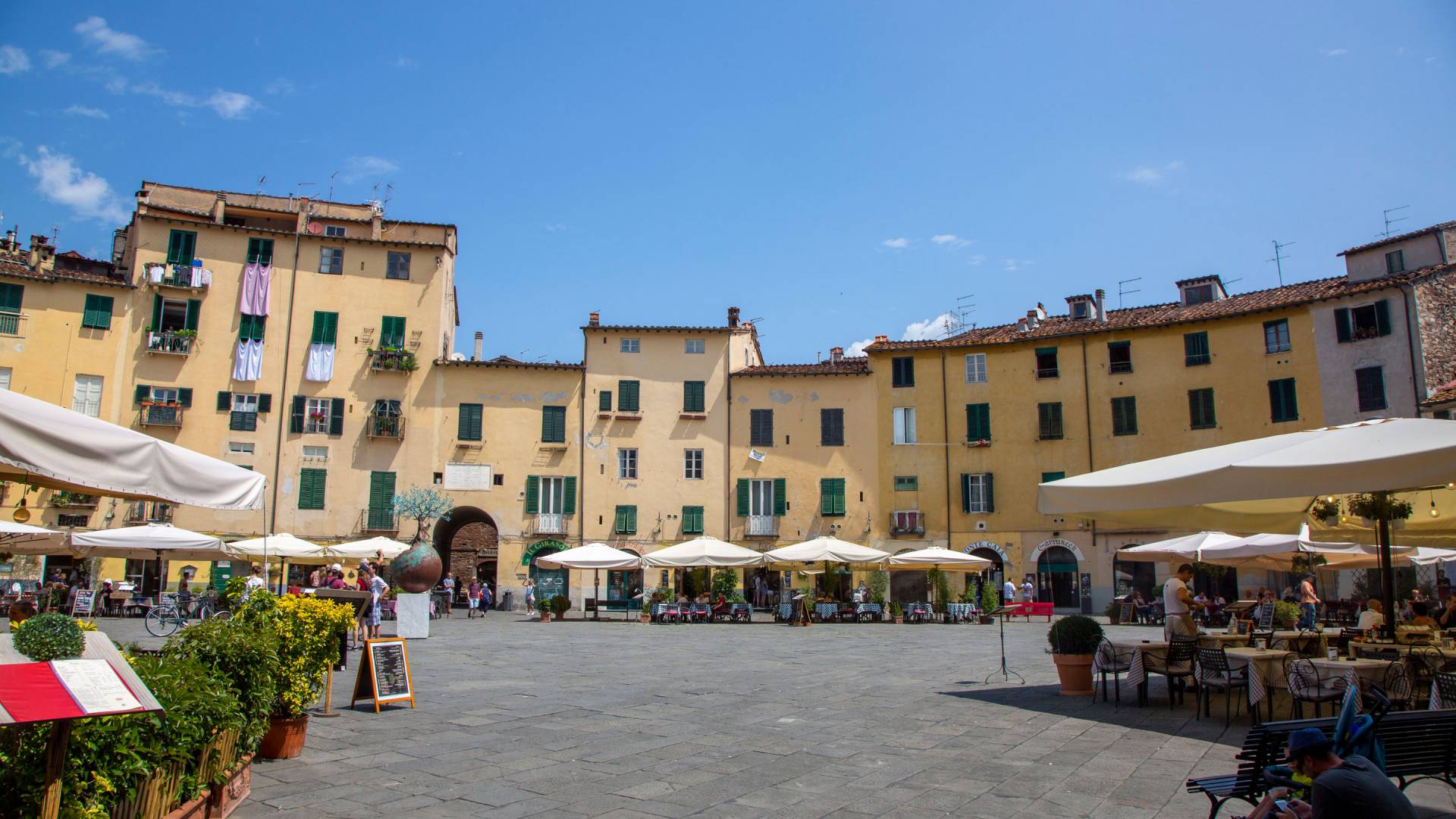 Square in Lucca surrounded by buildings