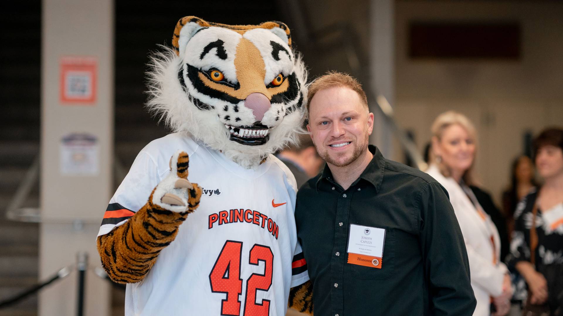 Tiger poses with a Princeton employee