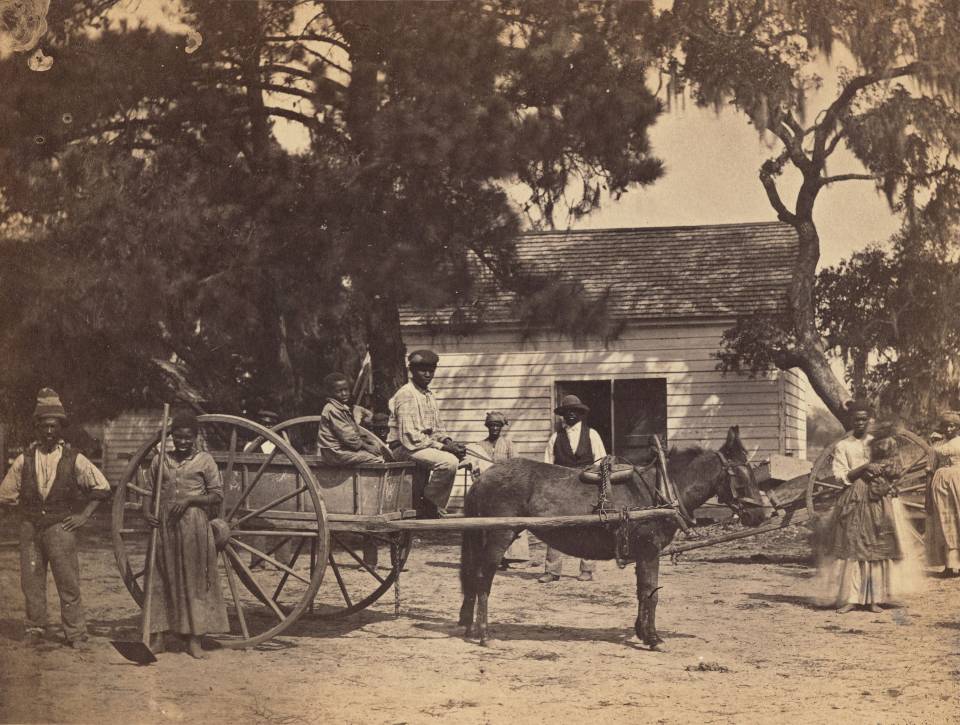 Old photograph of family with horse and cart