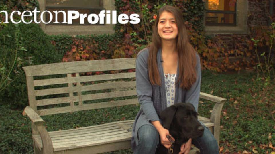 "Princeton Profiles" Camden Olsen sitting on bench with dog
