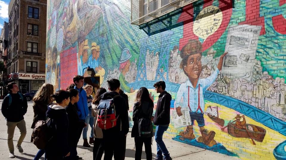 Students looking at mural in New York City
