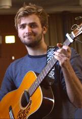 Between Classes: Lachlan Kermode with guitar