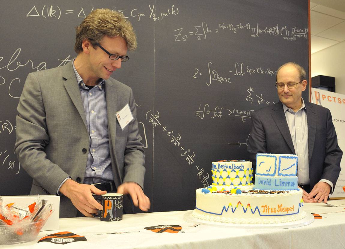 Titus Newport and PCTS director Paul Steinhart with a a cake decorated with designs drawn from their research