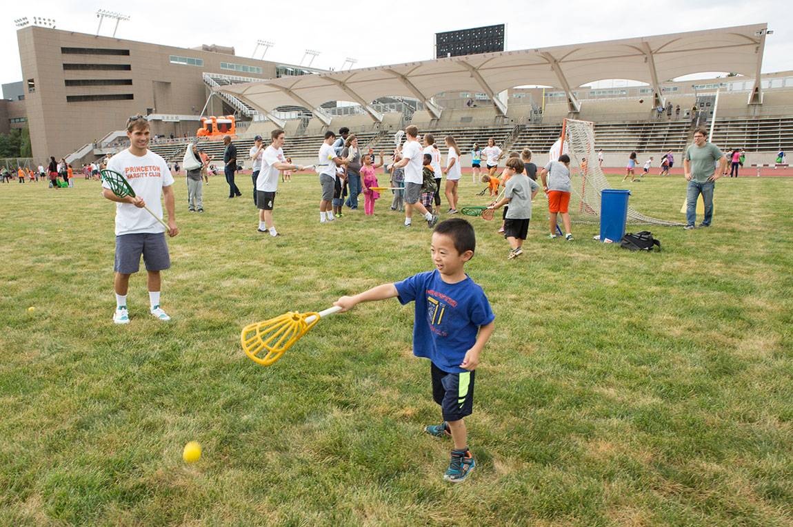 Learning lacrosse skills at Community and Staff Day