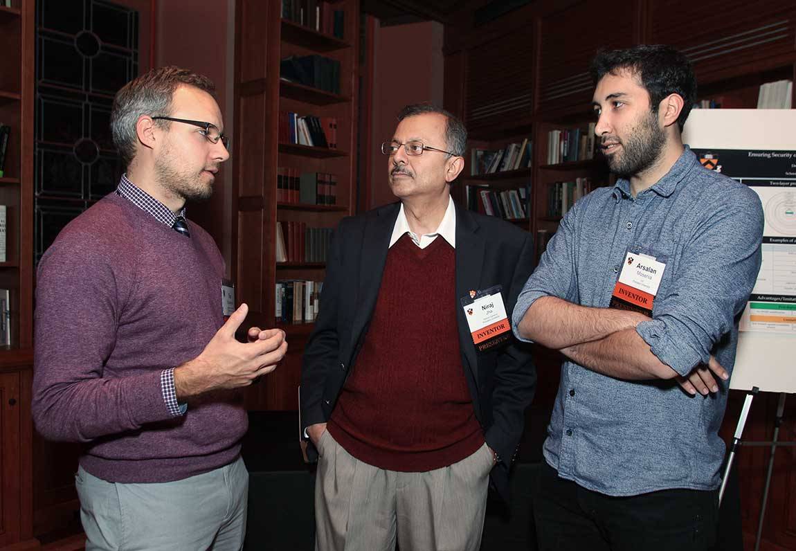Timothy Buschman, assistant professor of psychology and the Princeton Neuroscience Institute, talks with co-presenters Niraj Jha, a professor of electrical engineering and associate director for education, Andlinger Center for Energy and the Environment, and Arsalan Mosenia, a graduate student in electrical engineering. Jha and Mosenia presented work on enhancing security of implantable and wearable medical devices, and more broadly, the Internet of Things.