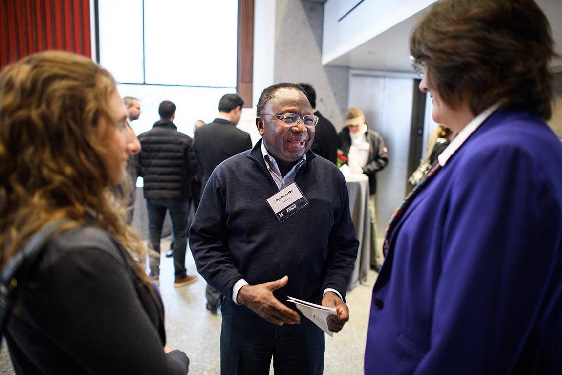 The Innovation Forum, held this year in Maeder Hall of the Andlinger Center for Energy and Environment, draws business draws leaders from a range of industries and offers networking opportunities. Oye Olukotun (center), chief executive officer of EpiGen Pharmaceuticals, spoke with other participants.