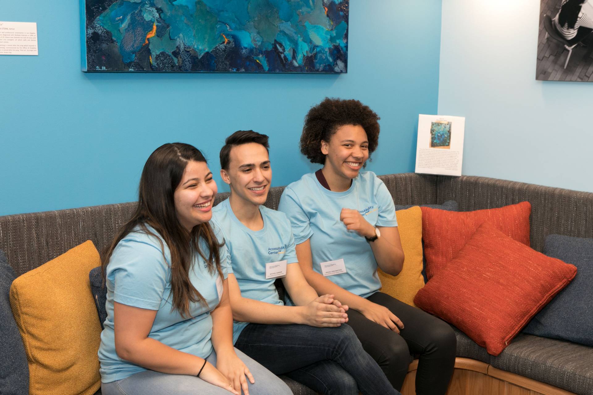 Office of Disability Services' student fellows, from left, Monica Magalhaes, Mitchell Hammer and Abby Jean-Baptiste sitting on couch