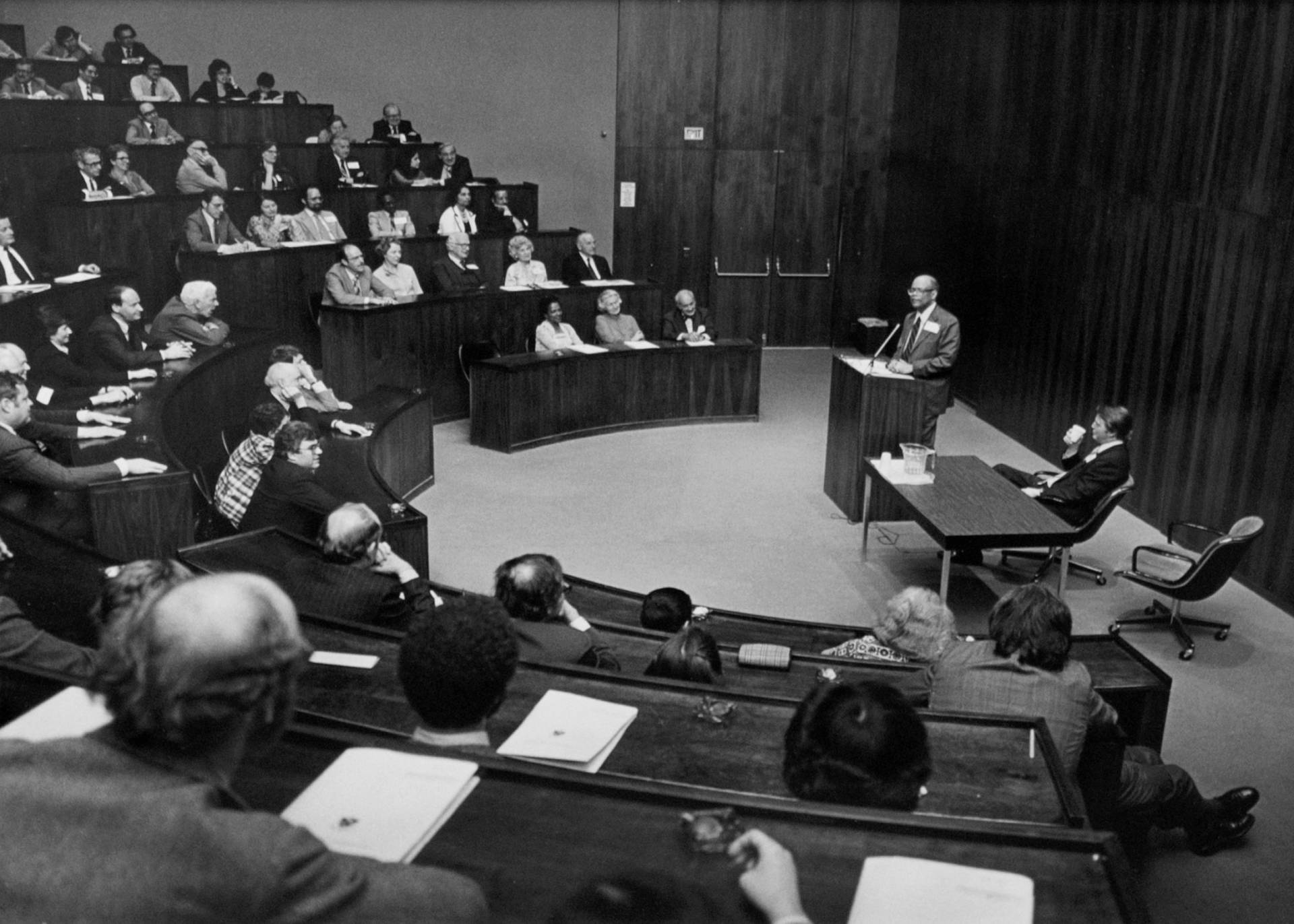 Sir Arthur Lewis giving lecture in auditorium at the Woodrow Wilson School in 1970s