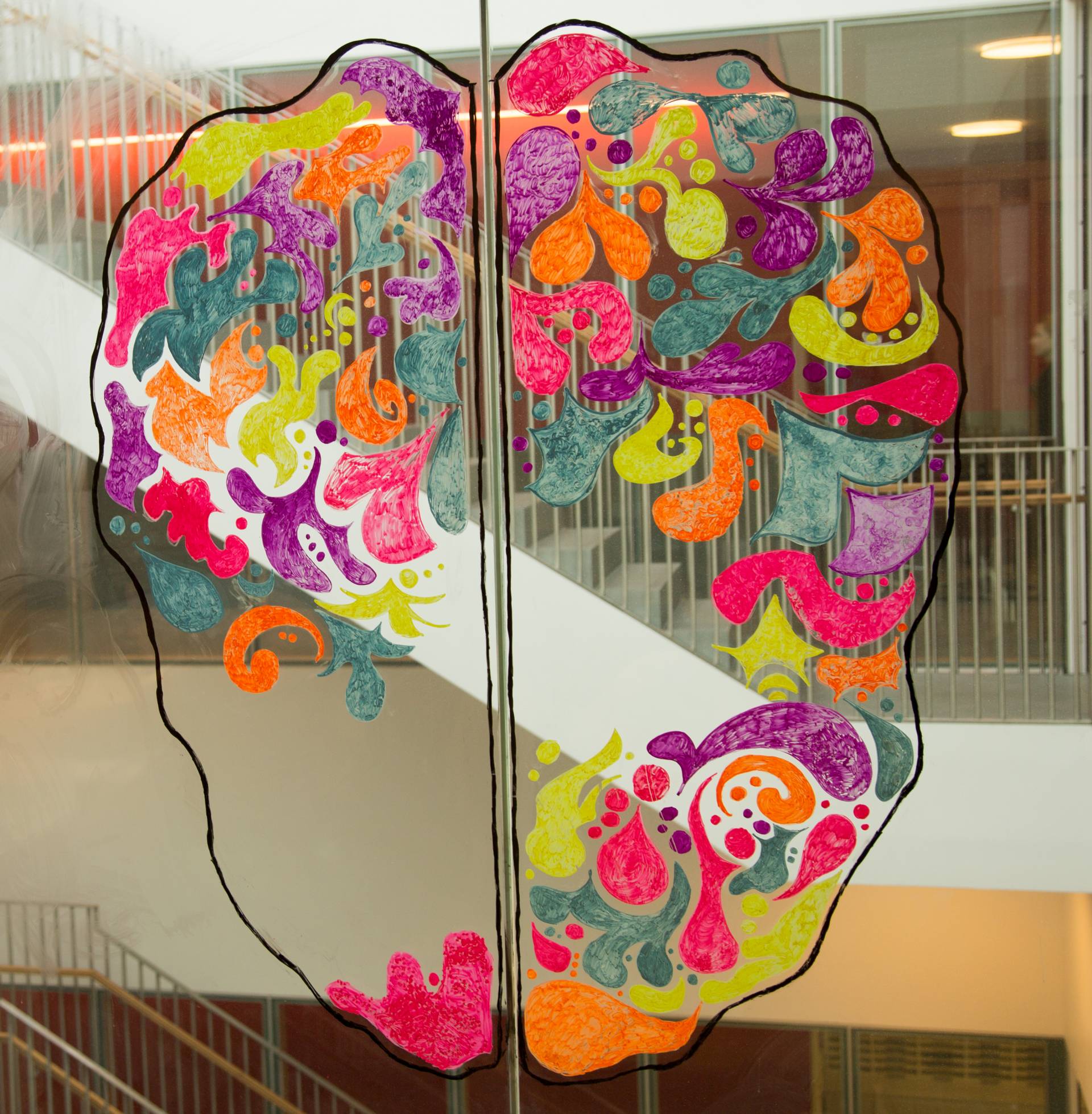 Mural on window of a colorful brain