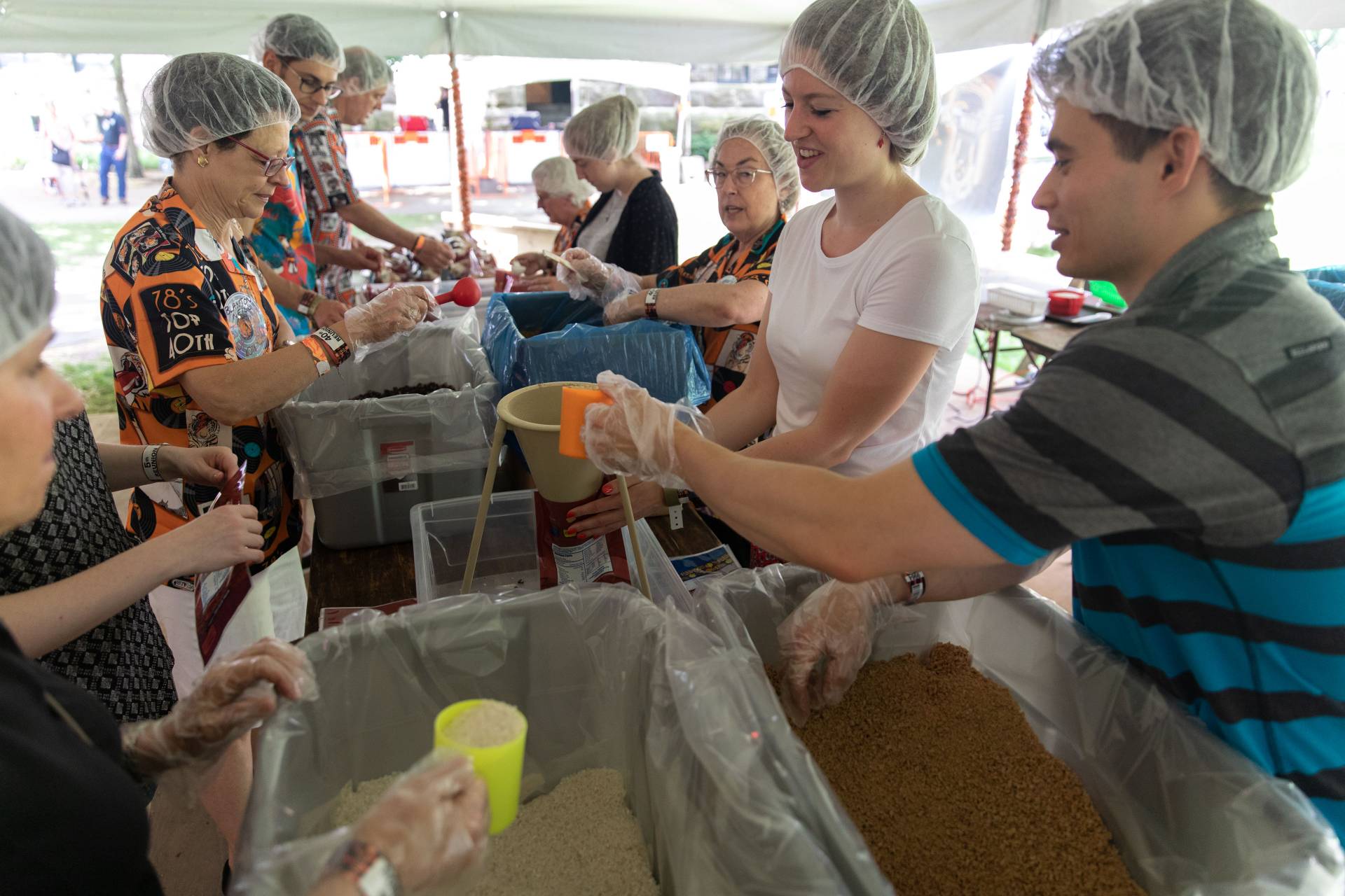 Alumni packing lunches for Kids Against Hunger during reunions