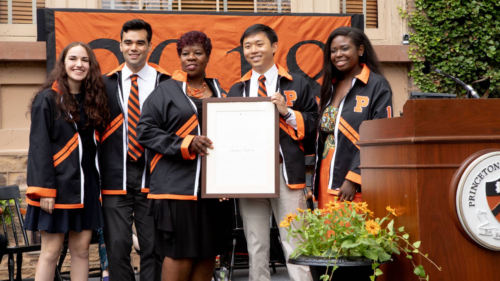 Barbara Baldwin receiving Class of 2018 Class Day jacket and certificate during Class Day ceremony