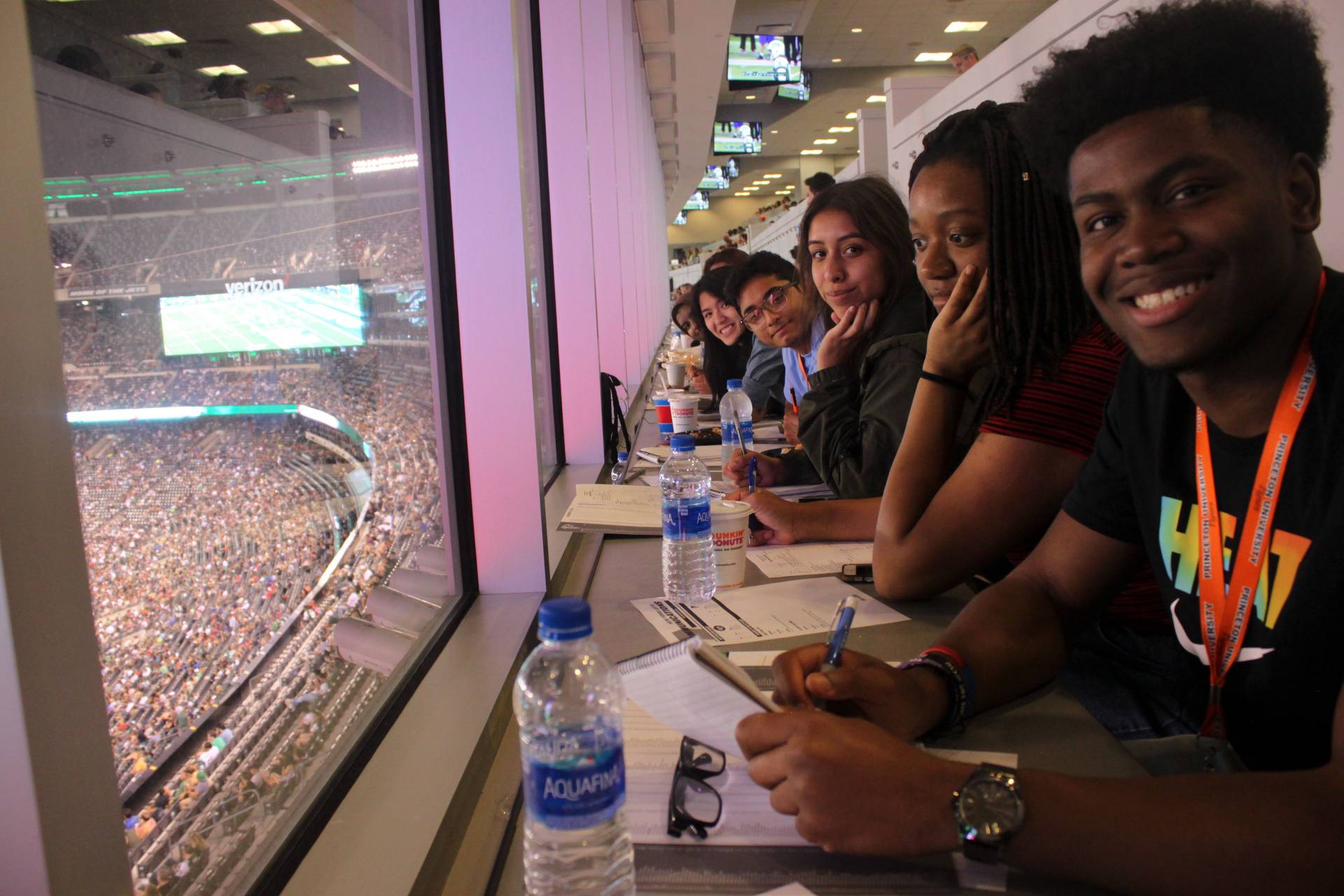 Summer Journalism Program students in press box during Jets football game