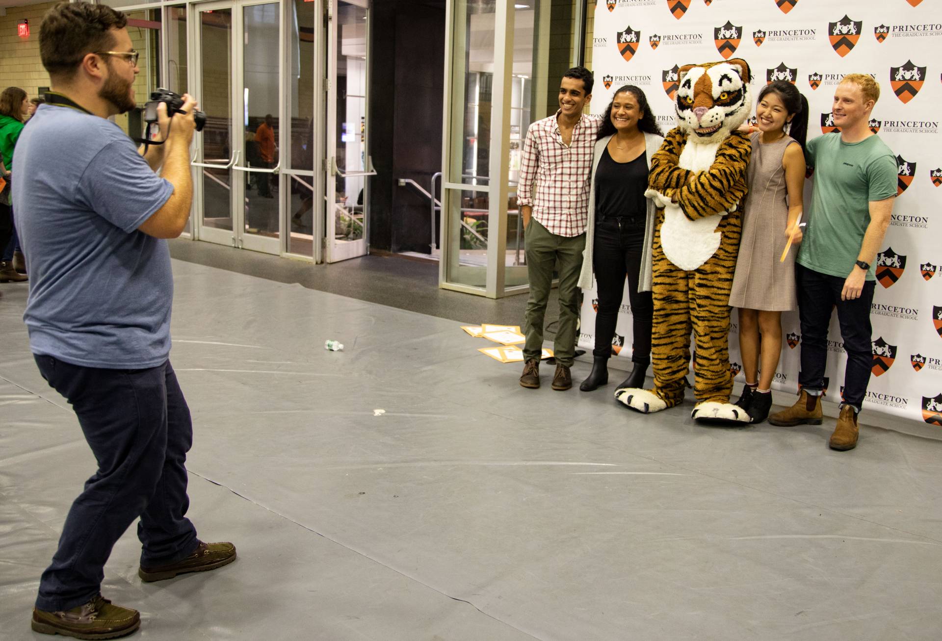 Graduate students posing with Princeton tiger mascot
