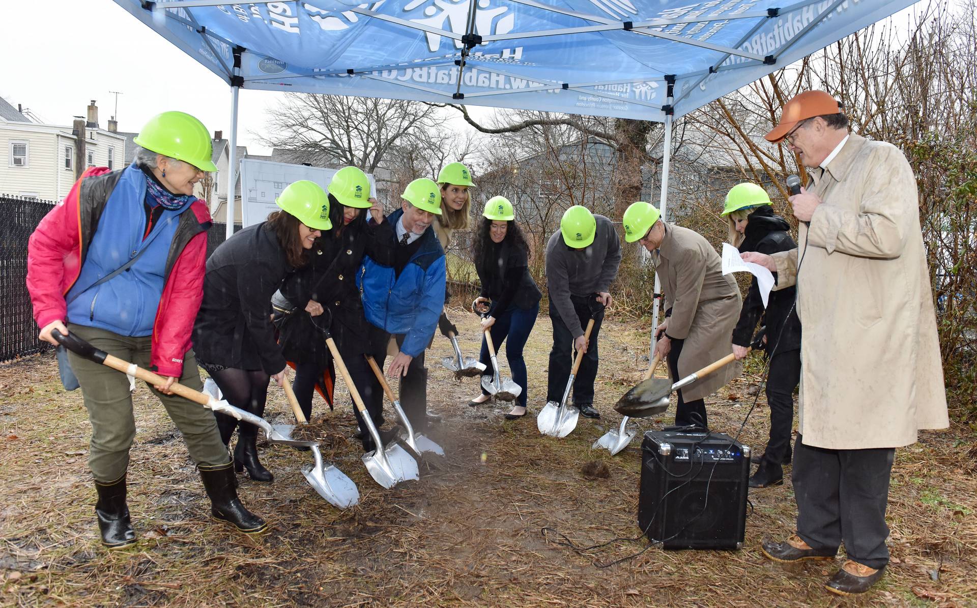 People from University, Princeton and Habitat for Humanity lifting shovels at ground breaking ceremony