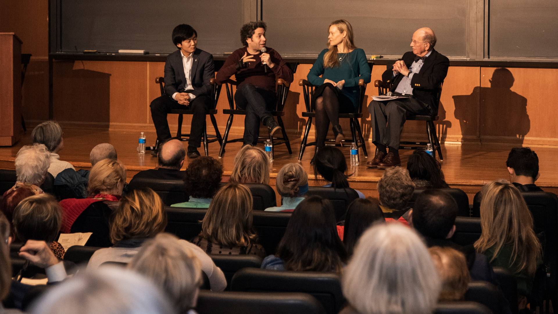 Lou Chen, Gustavo Dudamel, Anne Fitzgibbon, Stanley Katz sitting on stage during panel session