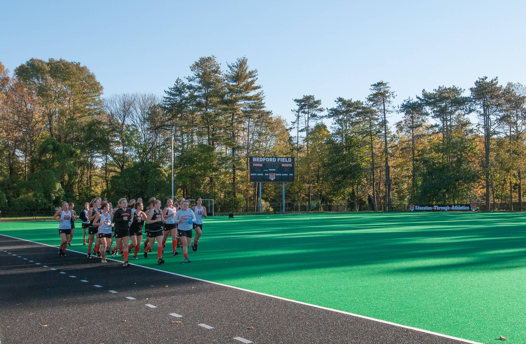 Students running on Bedford Field