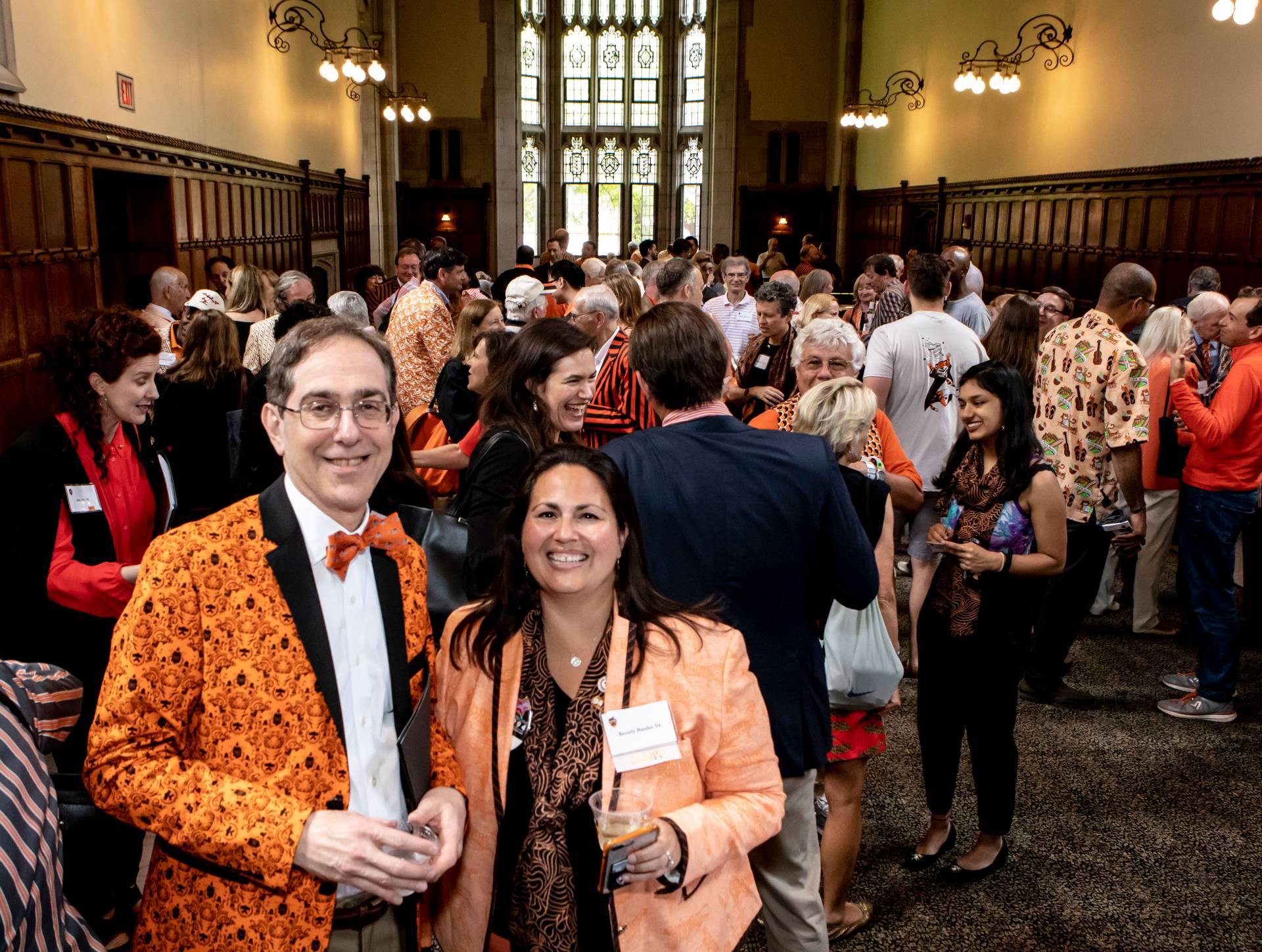 Christopher L. Eisgruber and Beverly Randez catch up at a Reunions reception