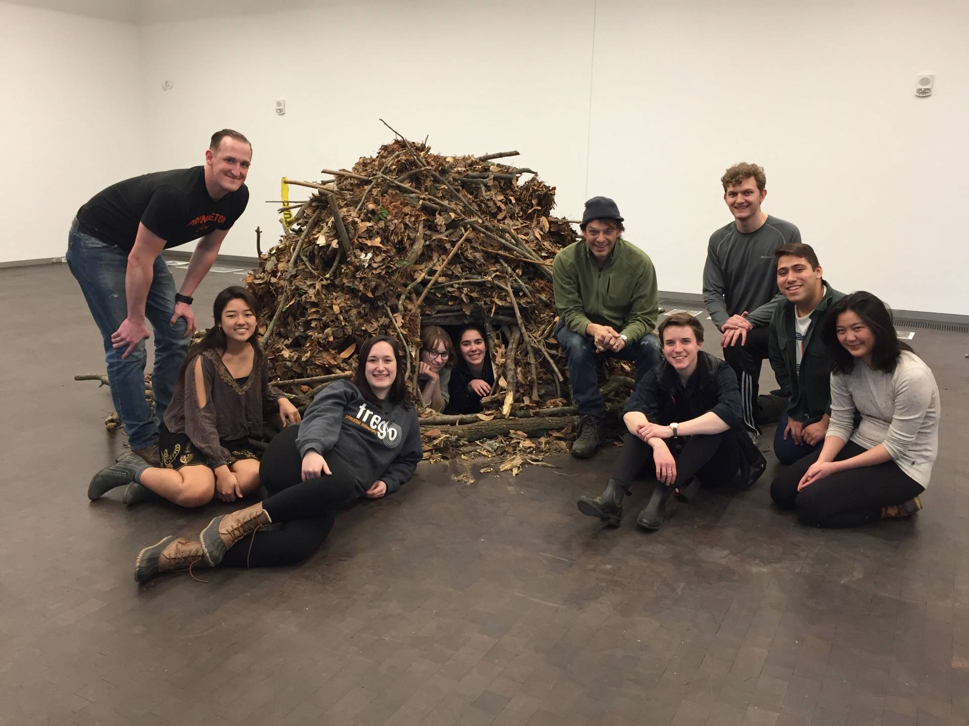 Class poses with the reconstructed beaver lodge