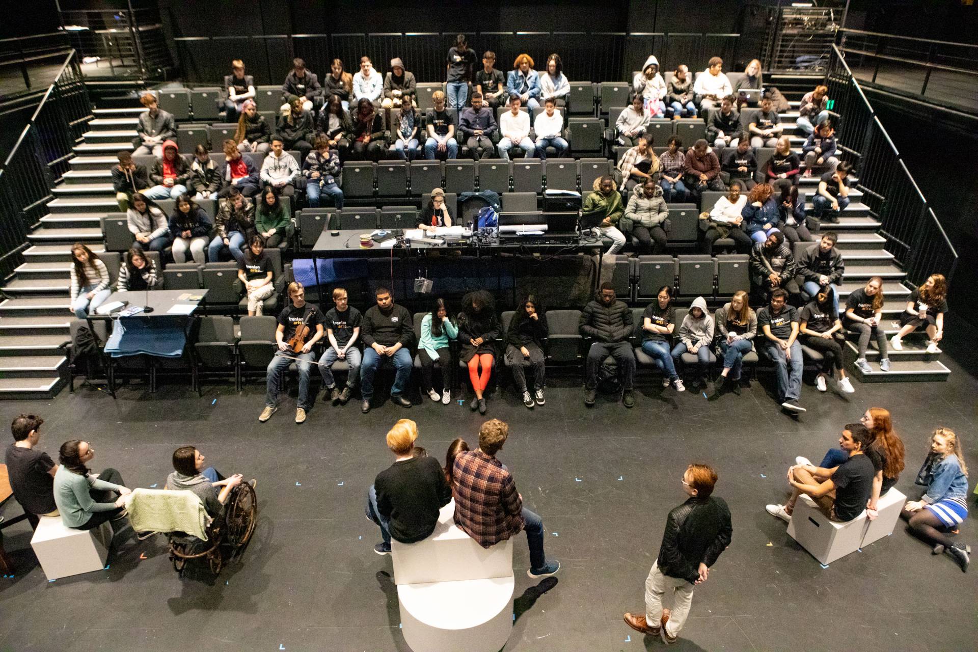 Students arrive for the morning in the Forum and watch a musical number of a Lewis Center student theater production and ask questions in the Wallace Theater