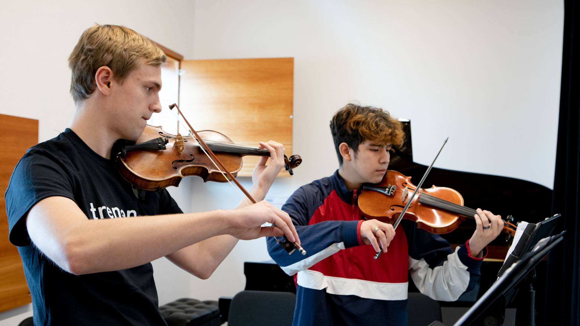 Nick Schmeller ’21 and Trenton student Michael Martinez having a private violin lesson