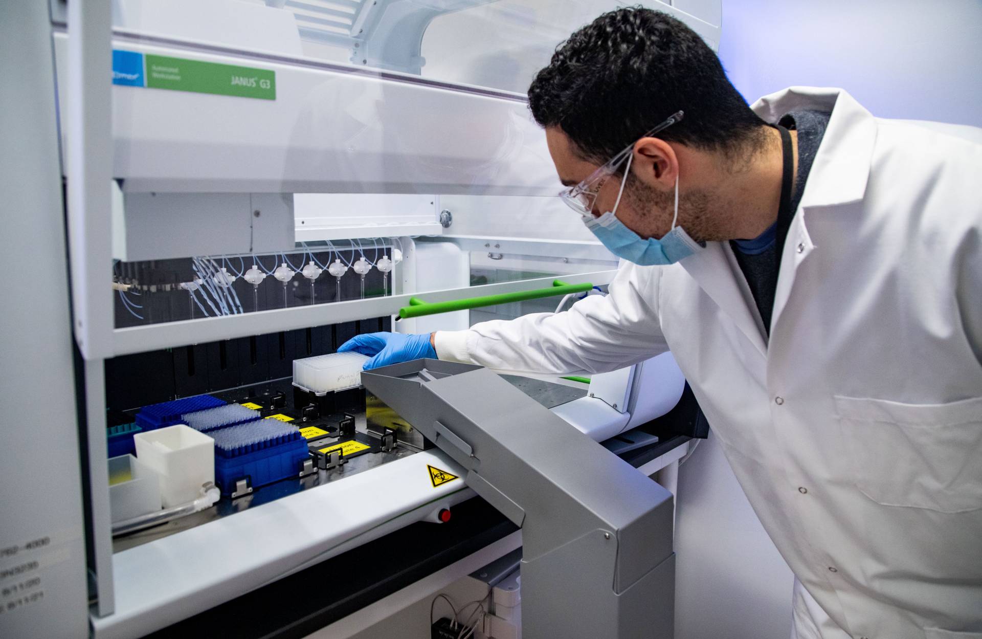 A lab technician handles samples