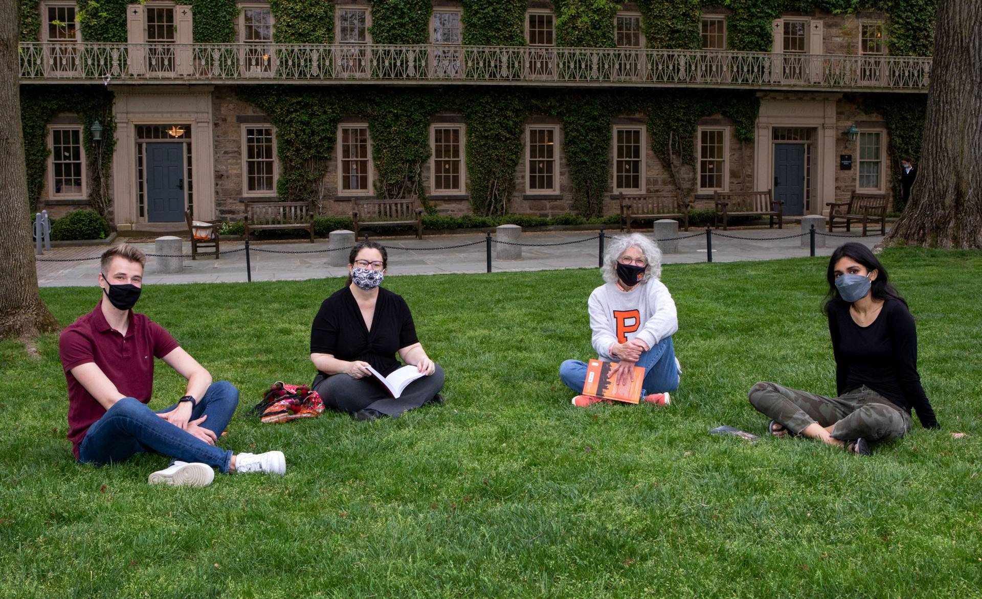 Jill Dolan holds a precept on the lawn outside Morrison Hall with with Beth Stroud and 2 students