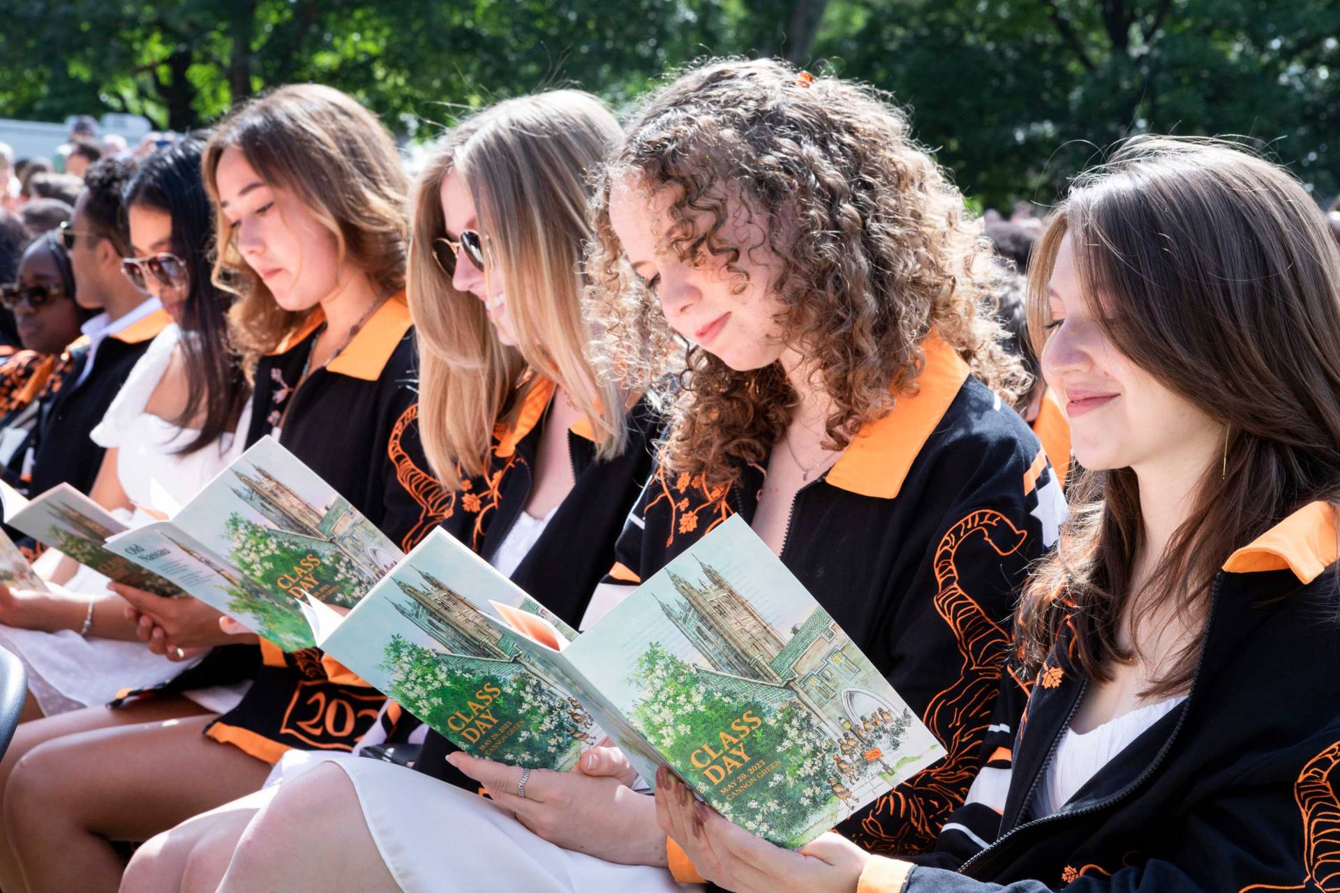 Students read their Class Day programs