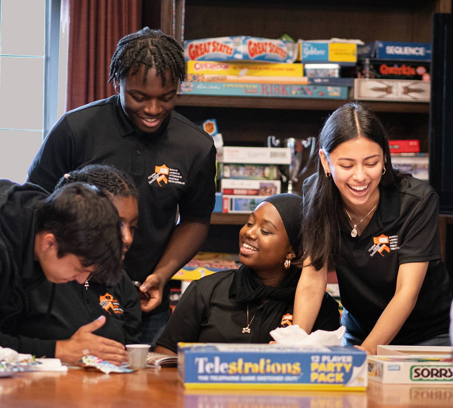 Students in the Princeton University Preparatory Program play games at lunch.