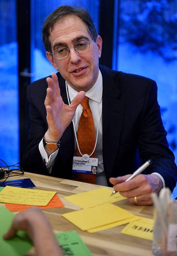 Pen in hand, Princeton President Christopher L. Eisgruber makes a point Thursday, Jan. 19, during a Princeton University "Ideas Lab" program at the annual World Economic Forum in Davos, Switzerland.