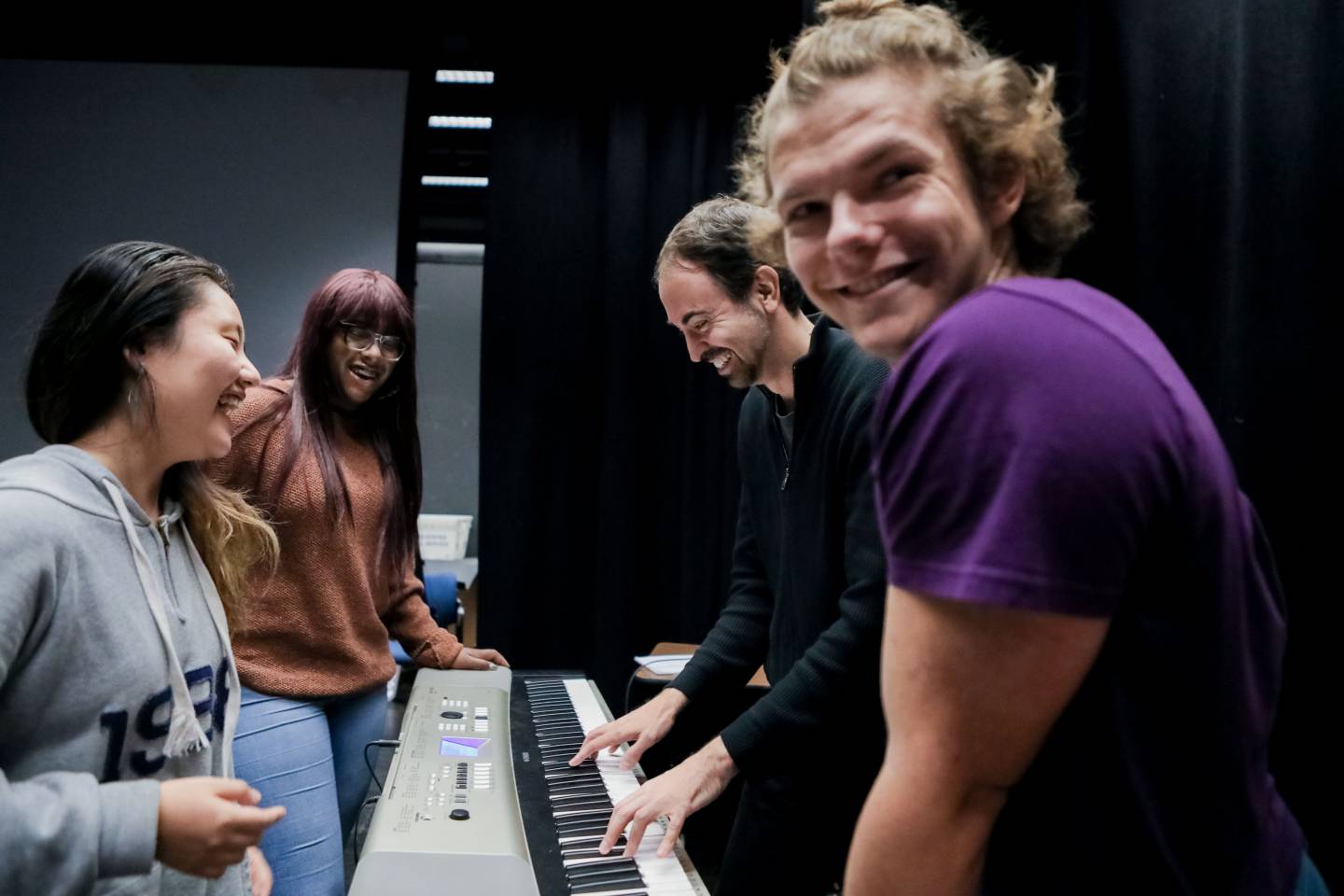 Students rehearsing at keyboard 