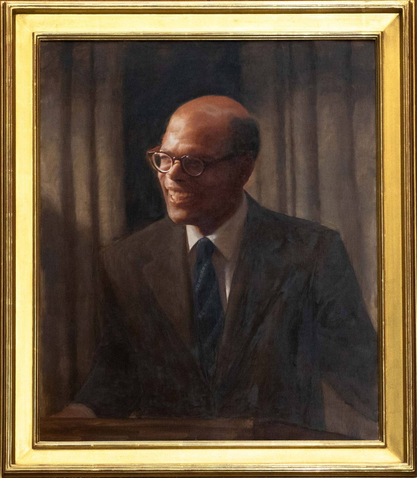 Framed portrait of Sir Arthur Lewis by Daniel Adel